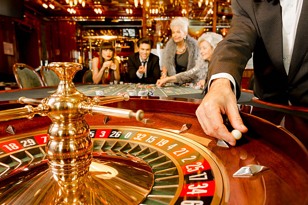 Some people are playing roulette in a very nice casino
